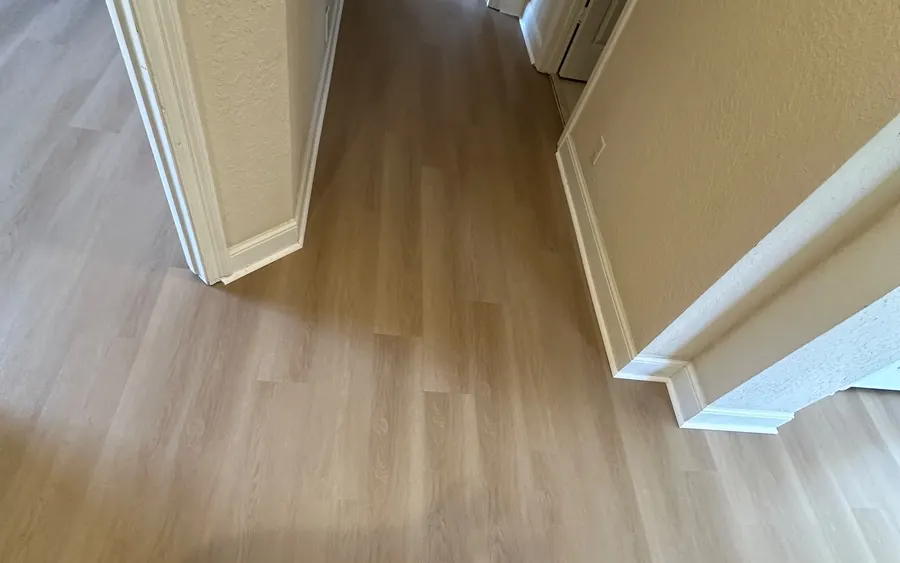 Finished wood-look plank flooring in a hallway