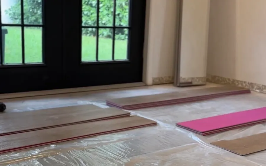 Flooring planks staged for installation on a protected floor